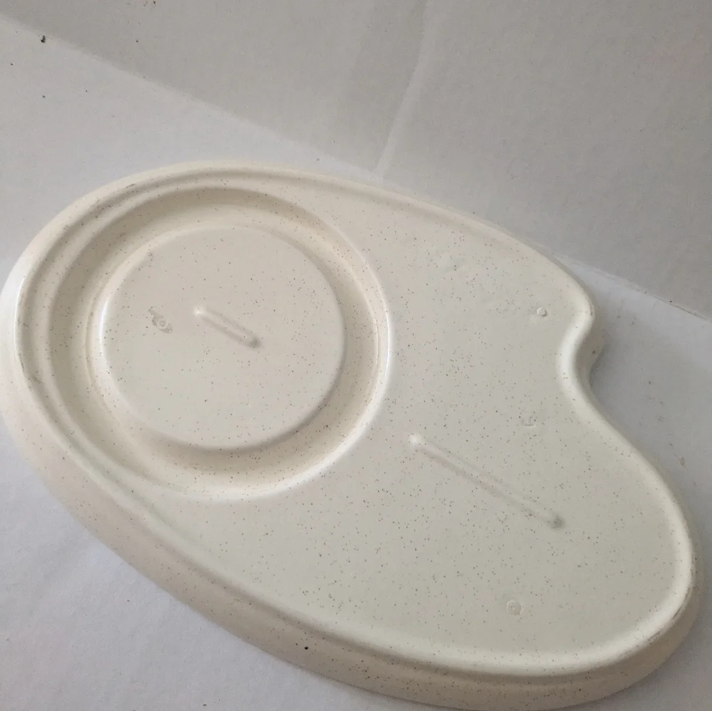 Retro speckled ceramic platter chip and dip.